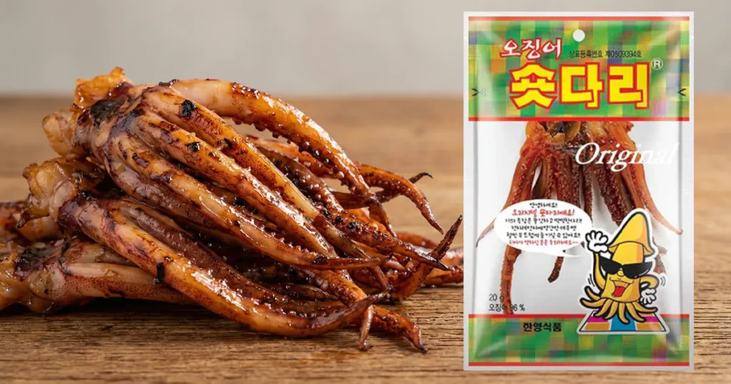 Glossy grilled squid legs placed next to a clear plastic package of Hanyang Short Leg snack.