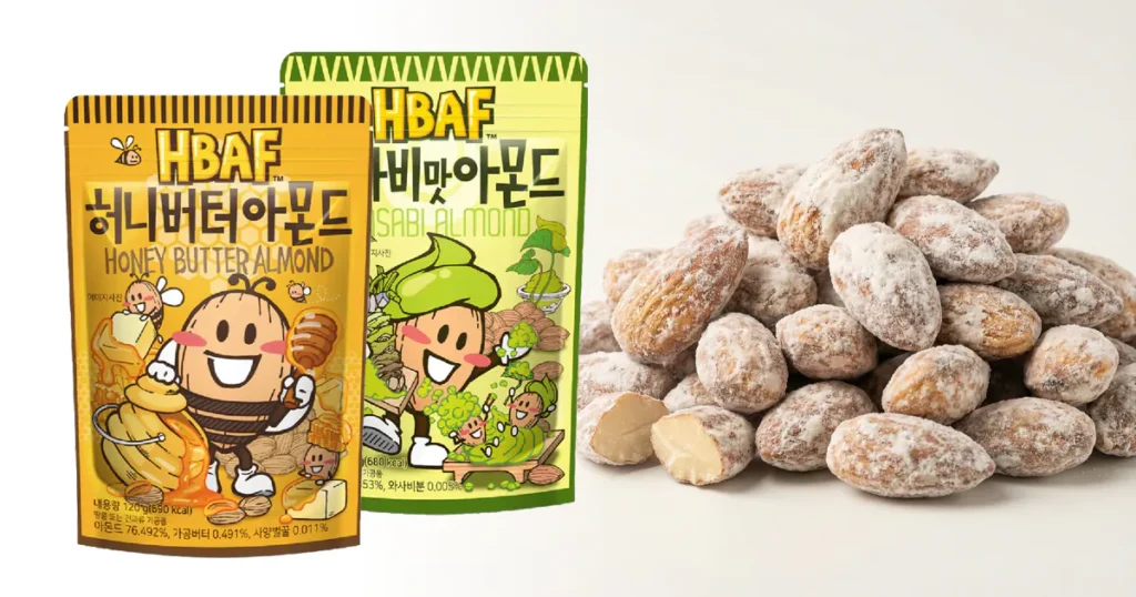 Yellow and green pouches of HBAF Honey Butter and Wasabi almonds alongside a mound of powder-coated nuts.